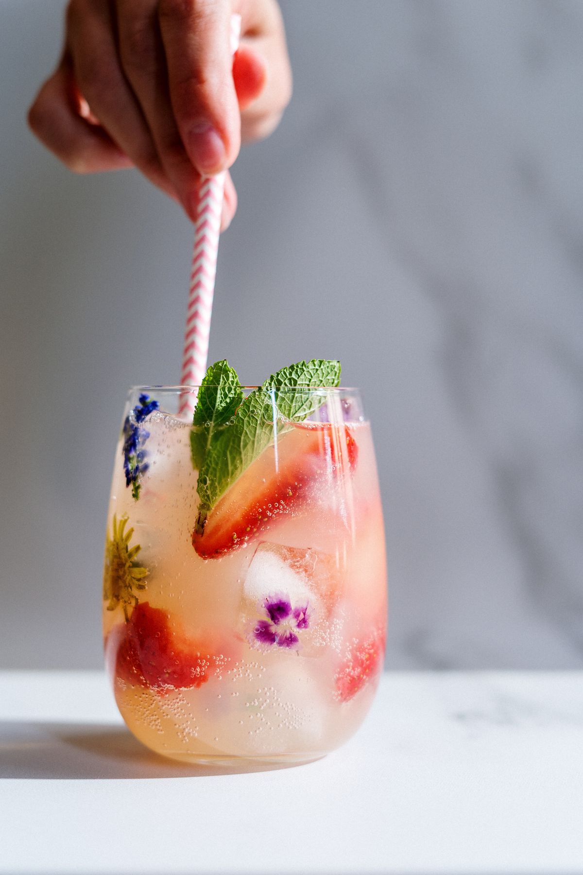 Sparkling strawberry mint non-alcoholic drink with fresh fruit and ice