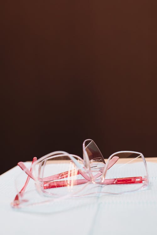 Clear Framed Safety Glasses on White Surface