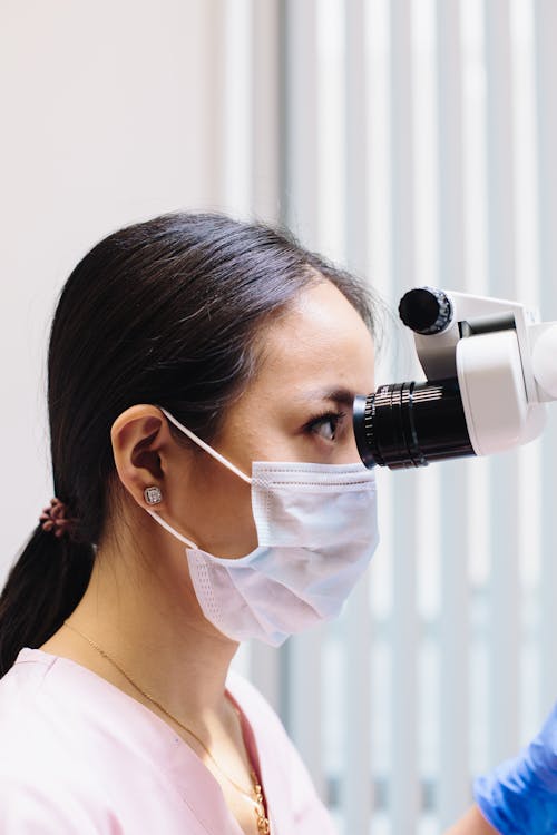 Brunette Woman Looking Through Eyepiece