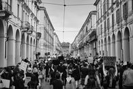 Black Lives Matter protest in the streets of Torino, Italy with placards and demonstrators.