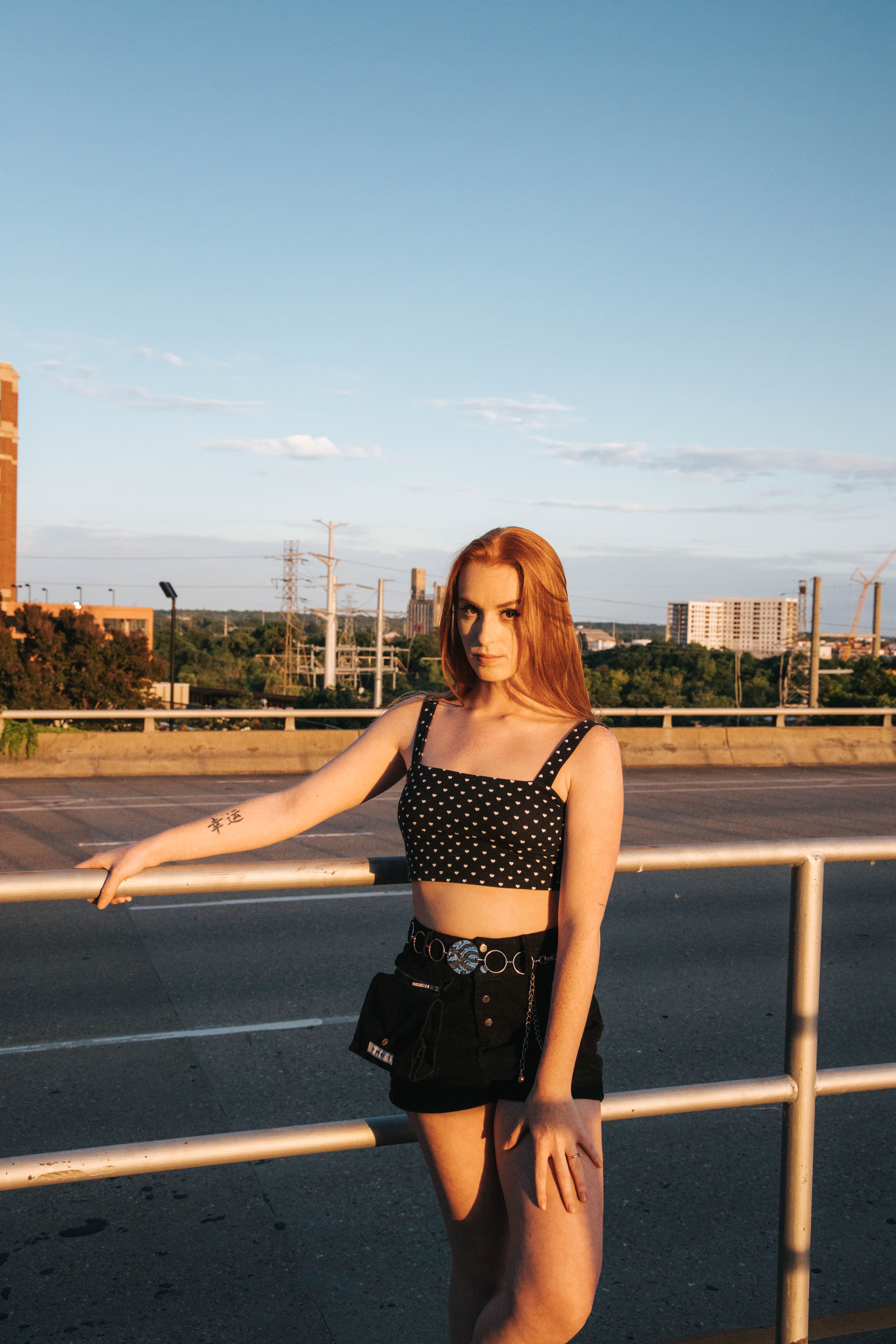 Young Woman Posing on Urban City Bridge at Sunset · Free Stock Photo