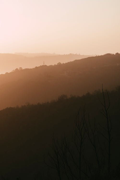 Silhouettes of Mountains at Dawn