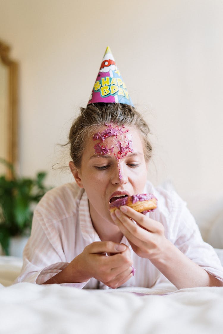 Woman In White Shirt Eating Bread