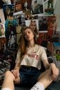 Attractive young woman sitting in room