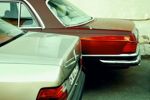 Close-up of classic sedans parked in Istanbul, showcasing vintage automotive design and urban setting.