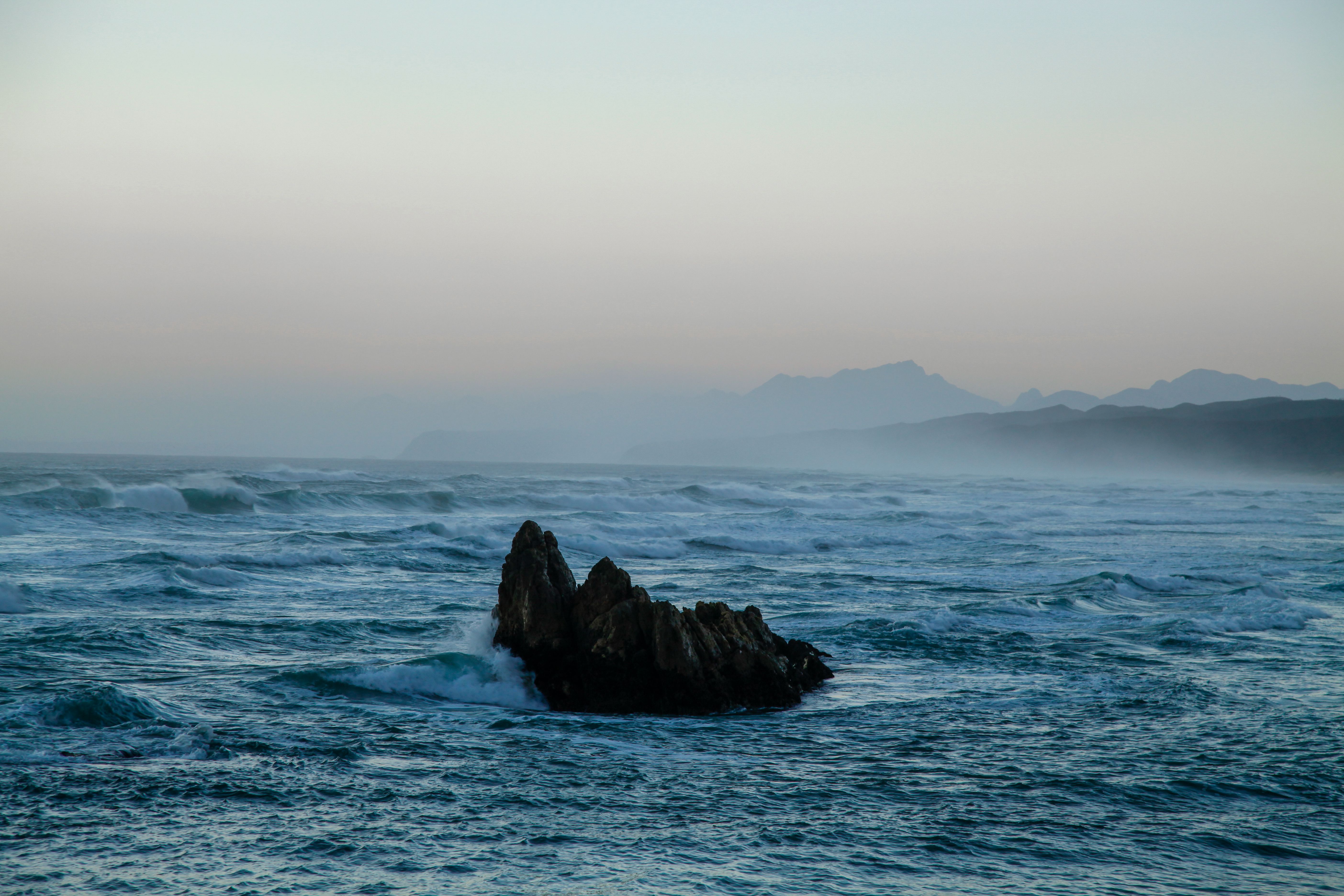 Black Rock Formation on Sea · Free Stock Photo