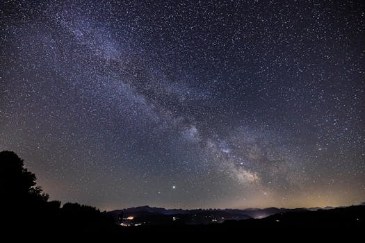 Stunning capture of the Milky Way illuminating the night sky over the Swiss Alps.