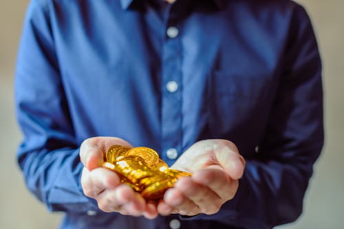 Free Person Holding Bitcoins Stock Photo