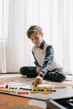 A focused child playing a strategy board game indoors.