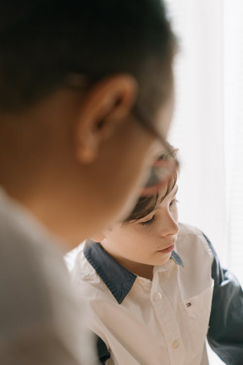 Man in White Dress Shirt Wearing Eyeglasses