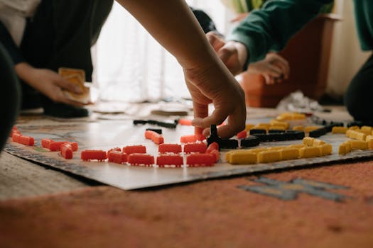 Friends enjoying a strategic board game session indoors, focusing on gameplay and fun interaction.