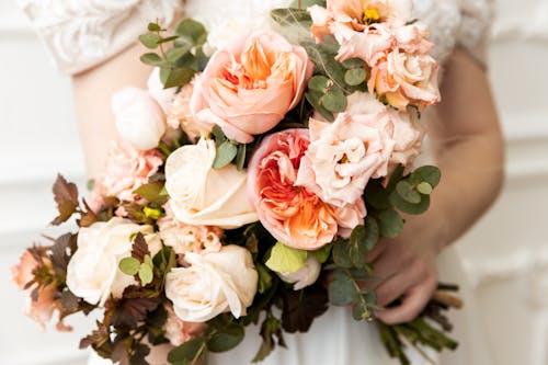 Person Holding a Flower Bouquet