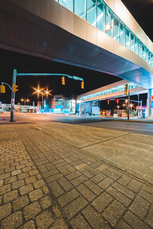 Pedestrian bridge over asphalt road and pavement