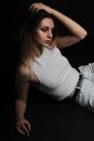 Stylish woman lying on floor