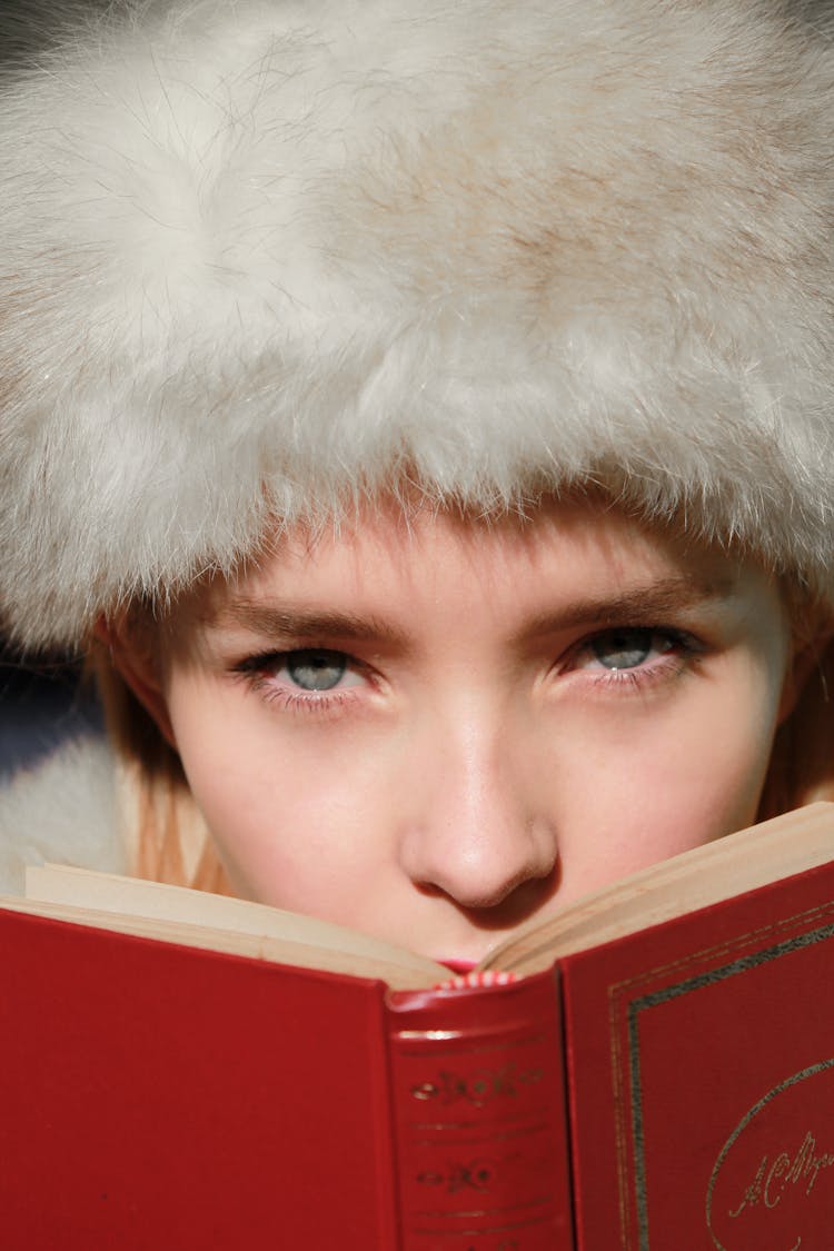 Woman Reading Book With Red Cover