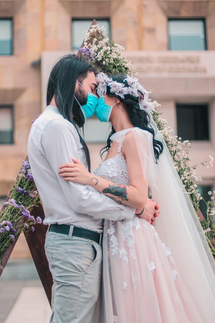 Amorous Wedding Couple In Masks