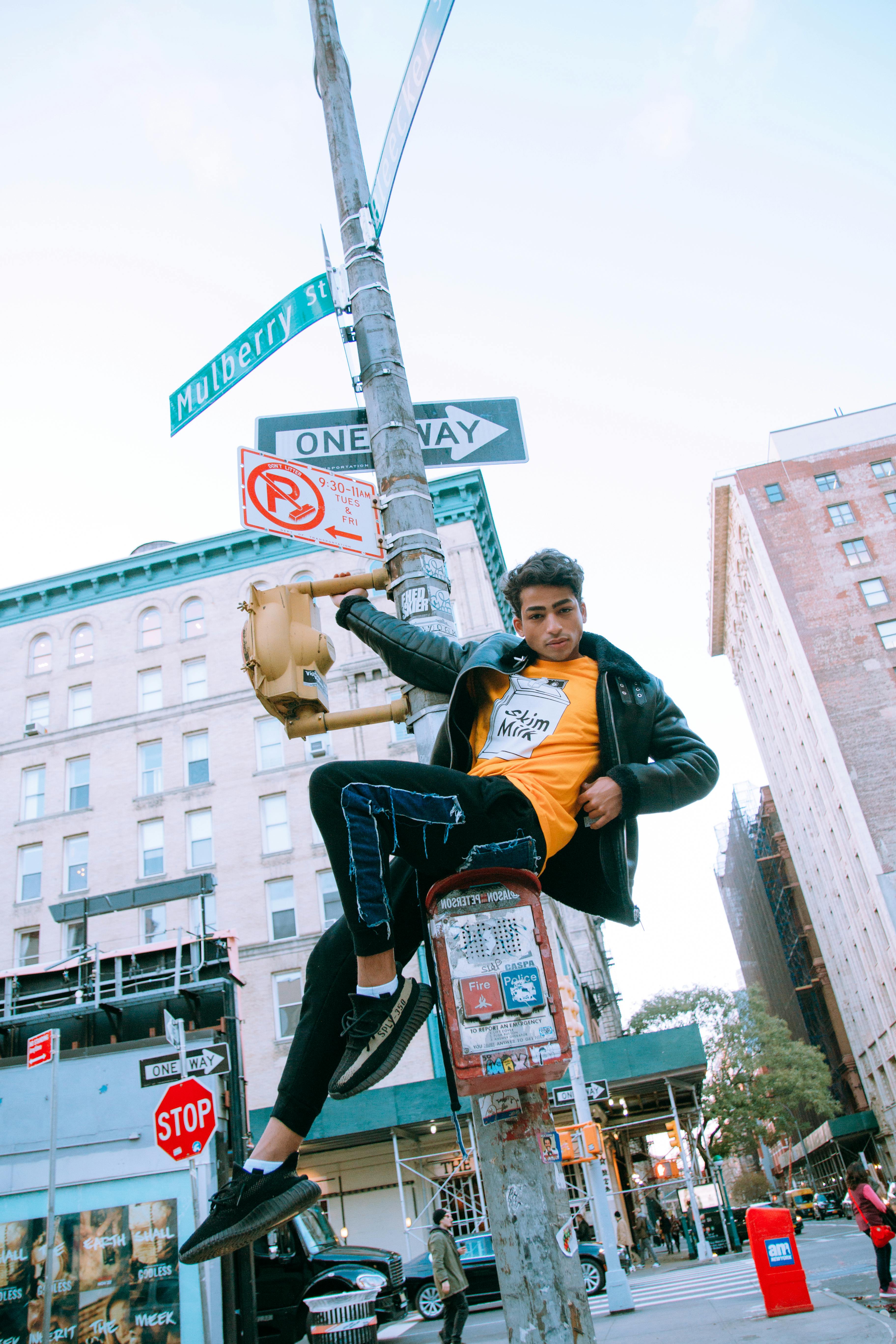 Confident male model posing in Soho, New York City street fashion scene.