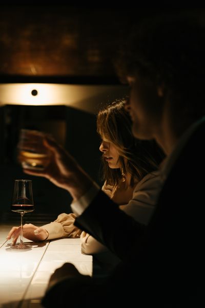 Dark moody romantic woman with wine — science of sensory connection