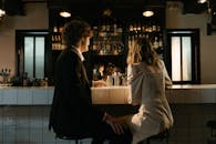 Man and Woman Sitting on Counter