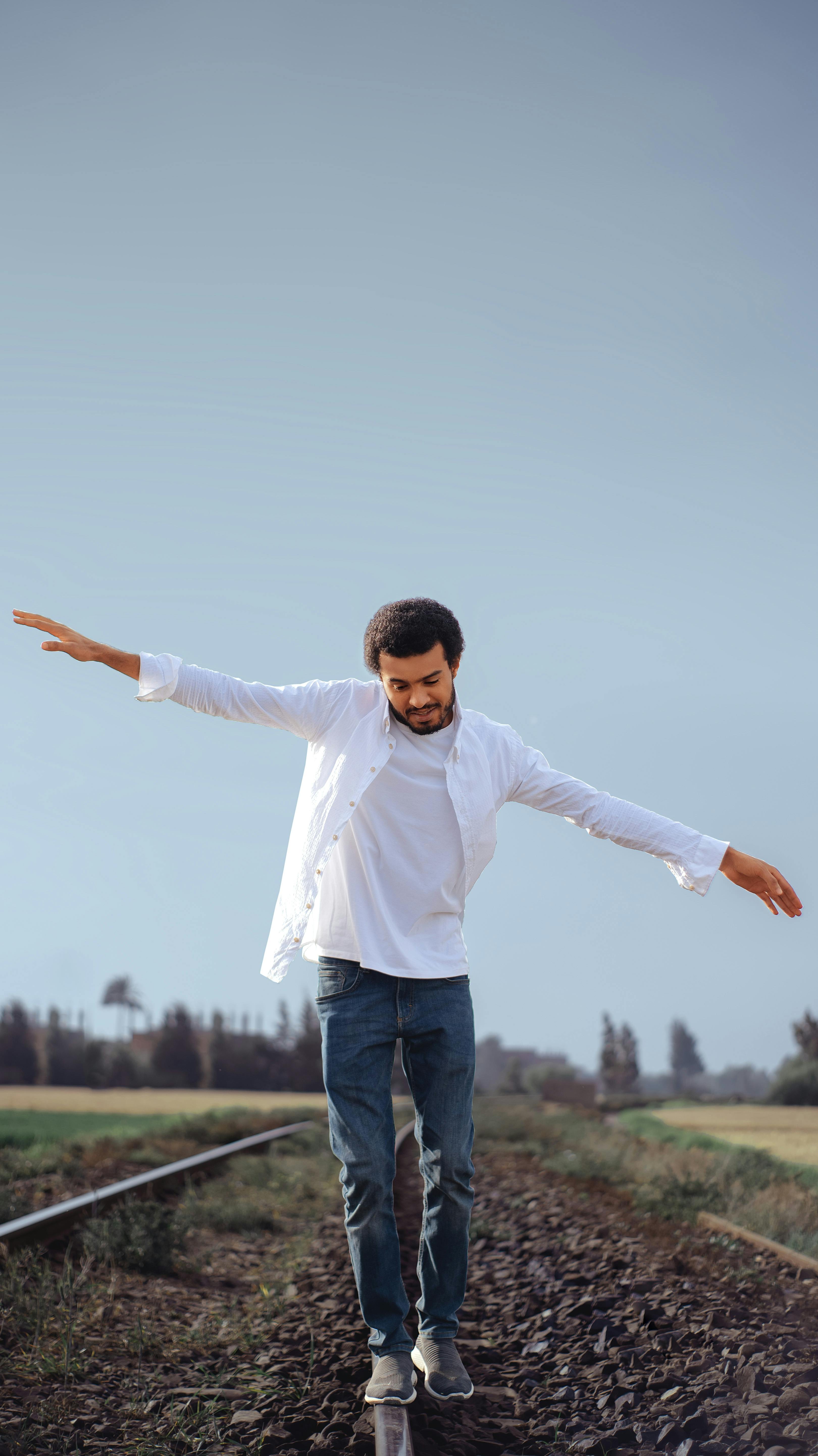 white dress shirt and blue jeans