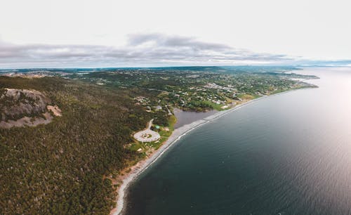 Aerial View Photo of Bay Under Cloudy Sky