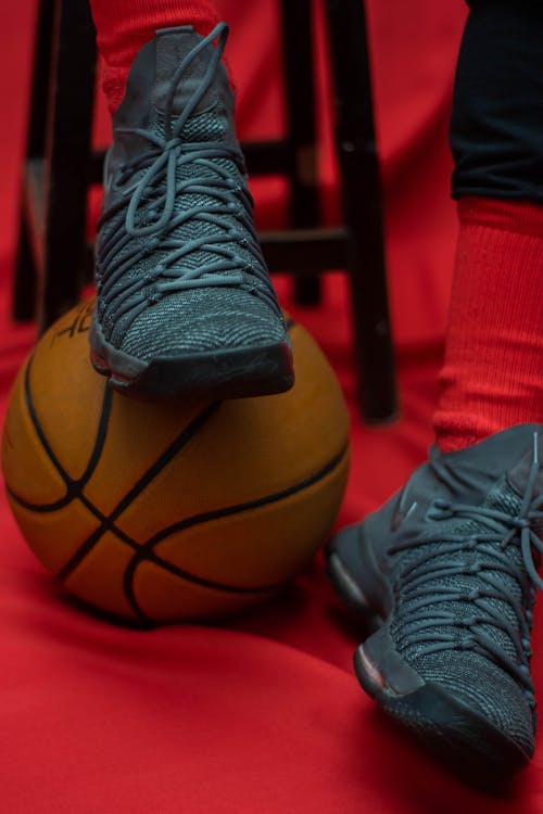 Free Person Wearing Black Nike Basketball Shoes Stock Photo