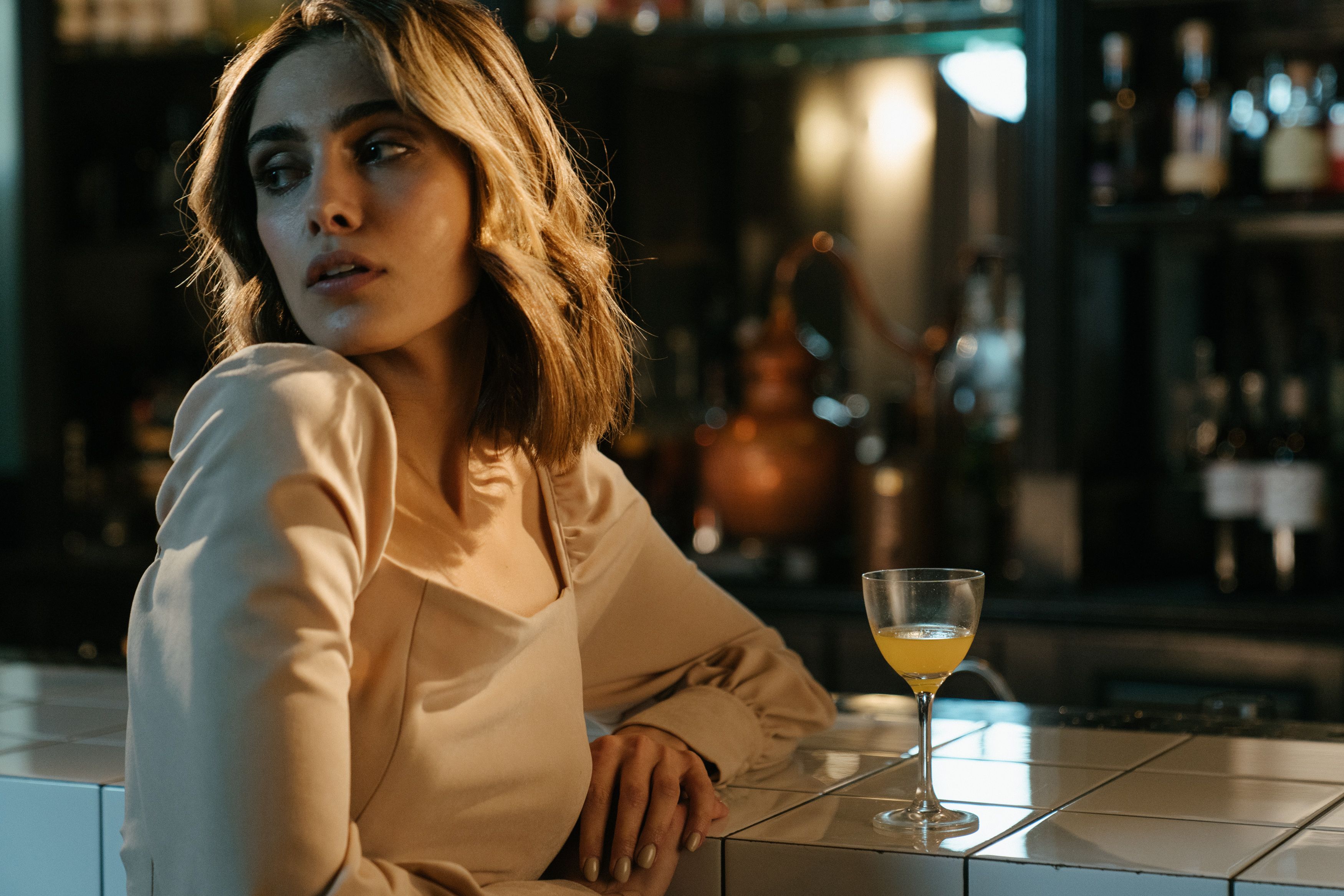 Woman in Beige Long Sleeve Shirt Holding Clear Wine Glass · Free Stock ...