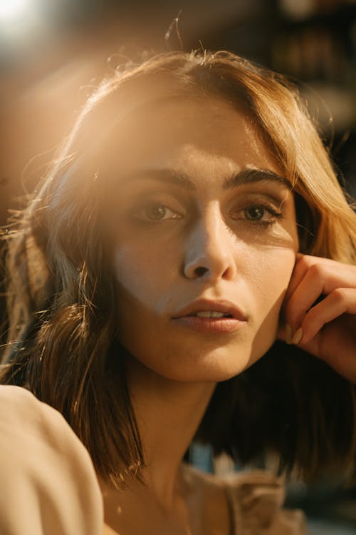 Woman in Black Shirt Holding Her Face