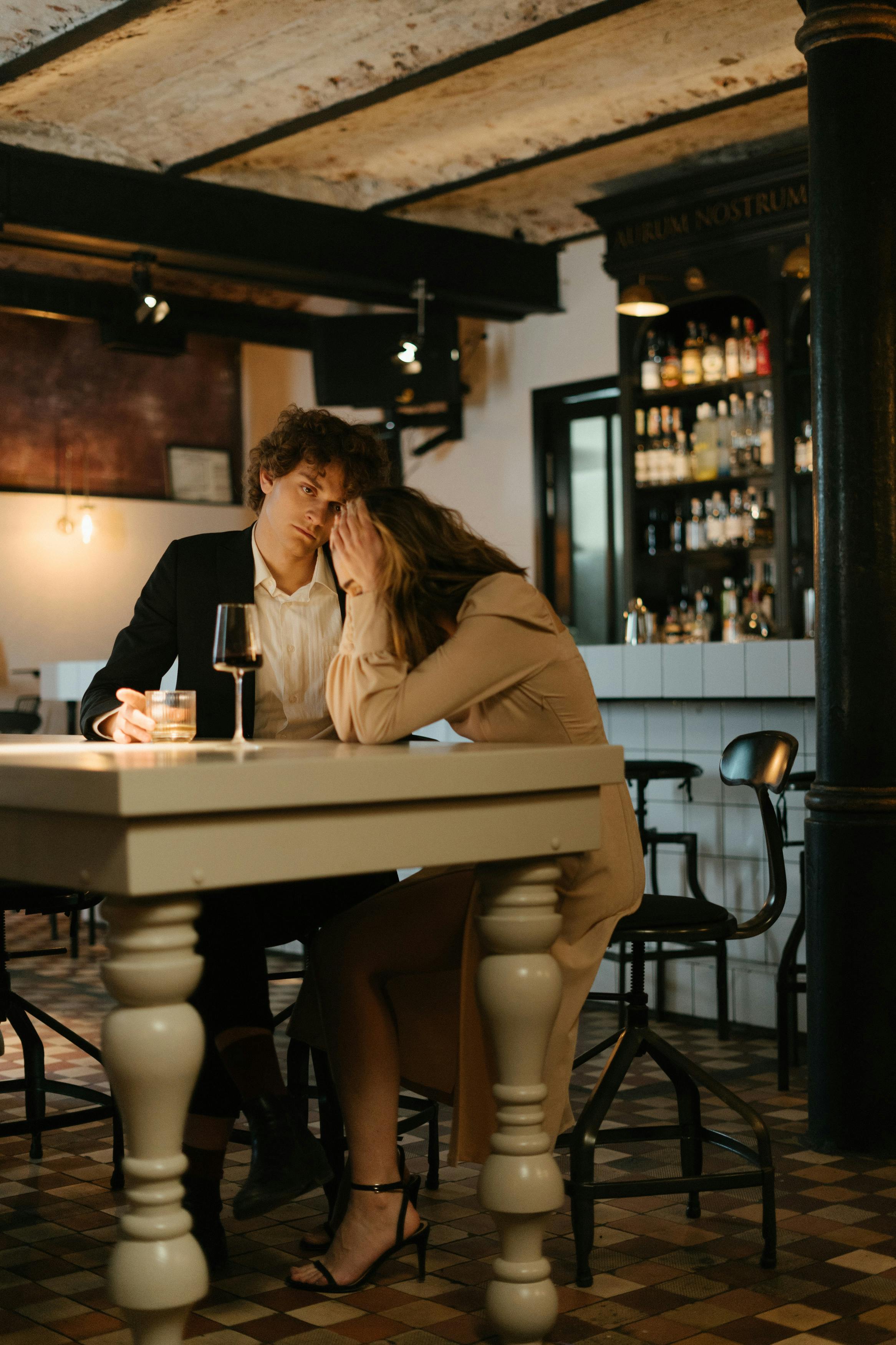 man and woman sitting at table