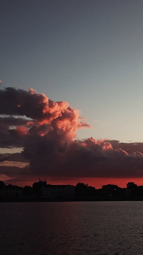 Free Sunset sky over city and river Stock Photo