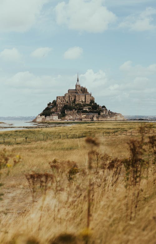 Photos gratuites de bord de mer, colline, église