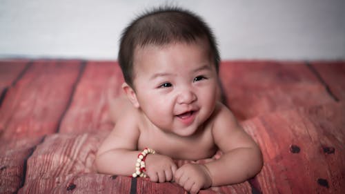 A Close-Up Shot of a Baby Smiling