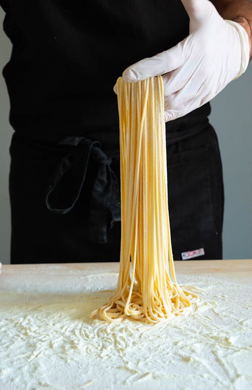 Free A Person Making Spaghetti Pasta Stock Photo