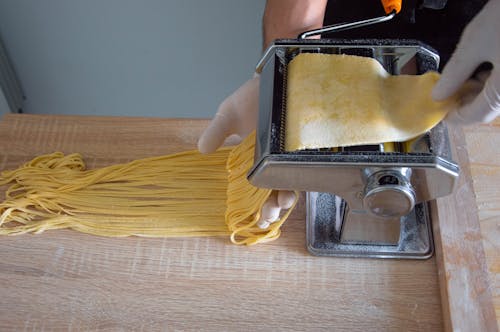 Free A Person Making a Spaghetti Pasta Stock Photo