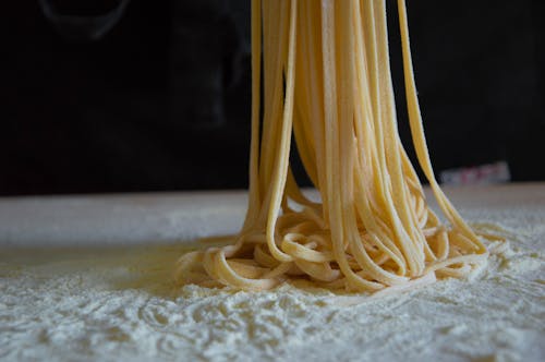 Free A Close-Up Shot of a Raw Homemade Spaghetti Pasta Stock Photo
