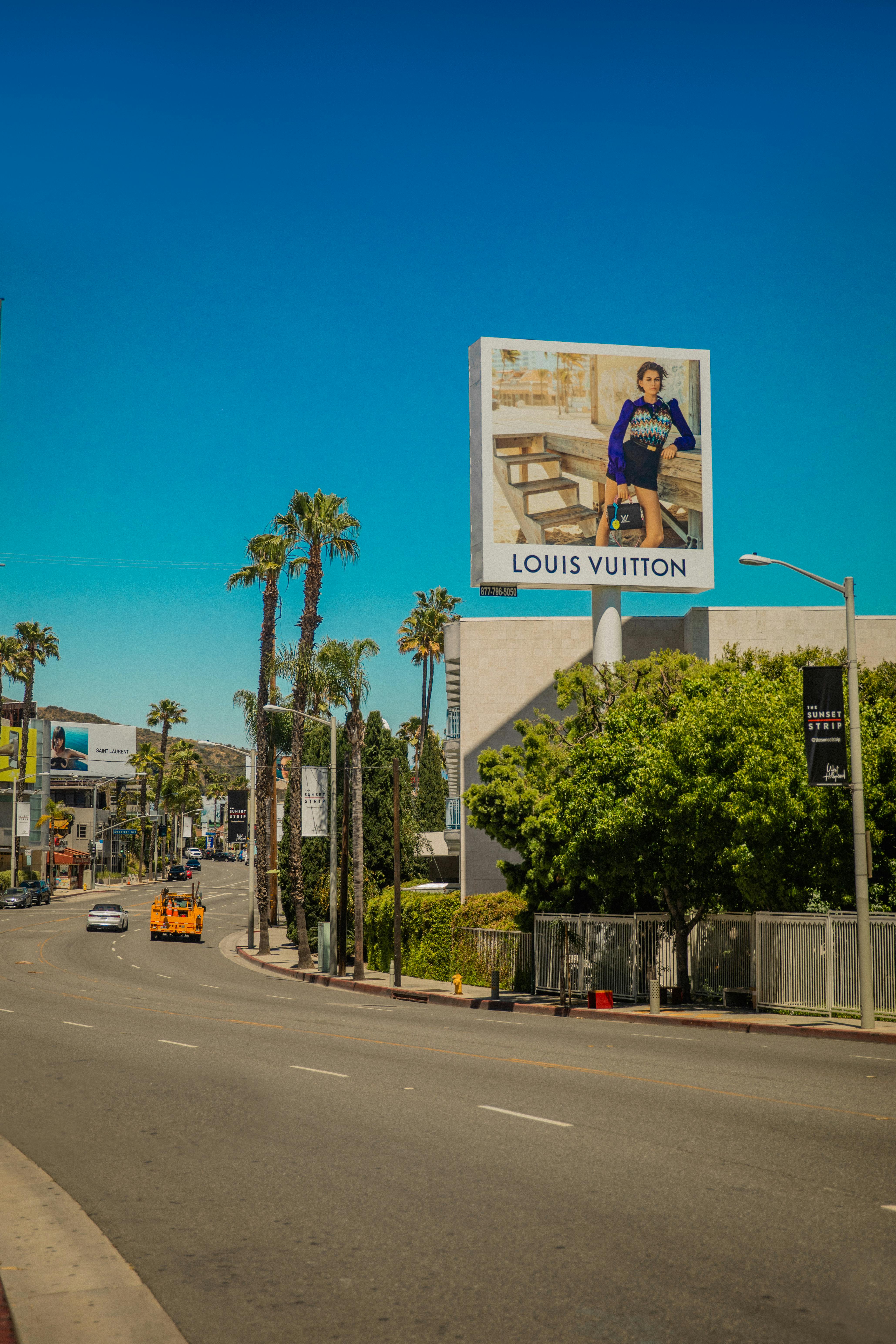 Louis Vuitton Billboard Near the Building · Free Stock Photo