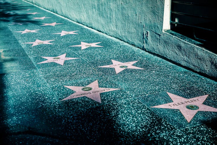 Pink Stars On Gray Tiled Street Sidewalk 