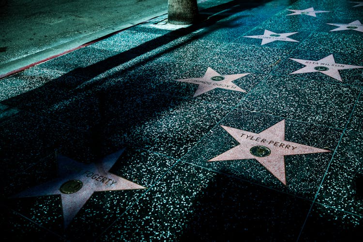  Stars On Gray And Black Tiled Sidewalk