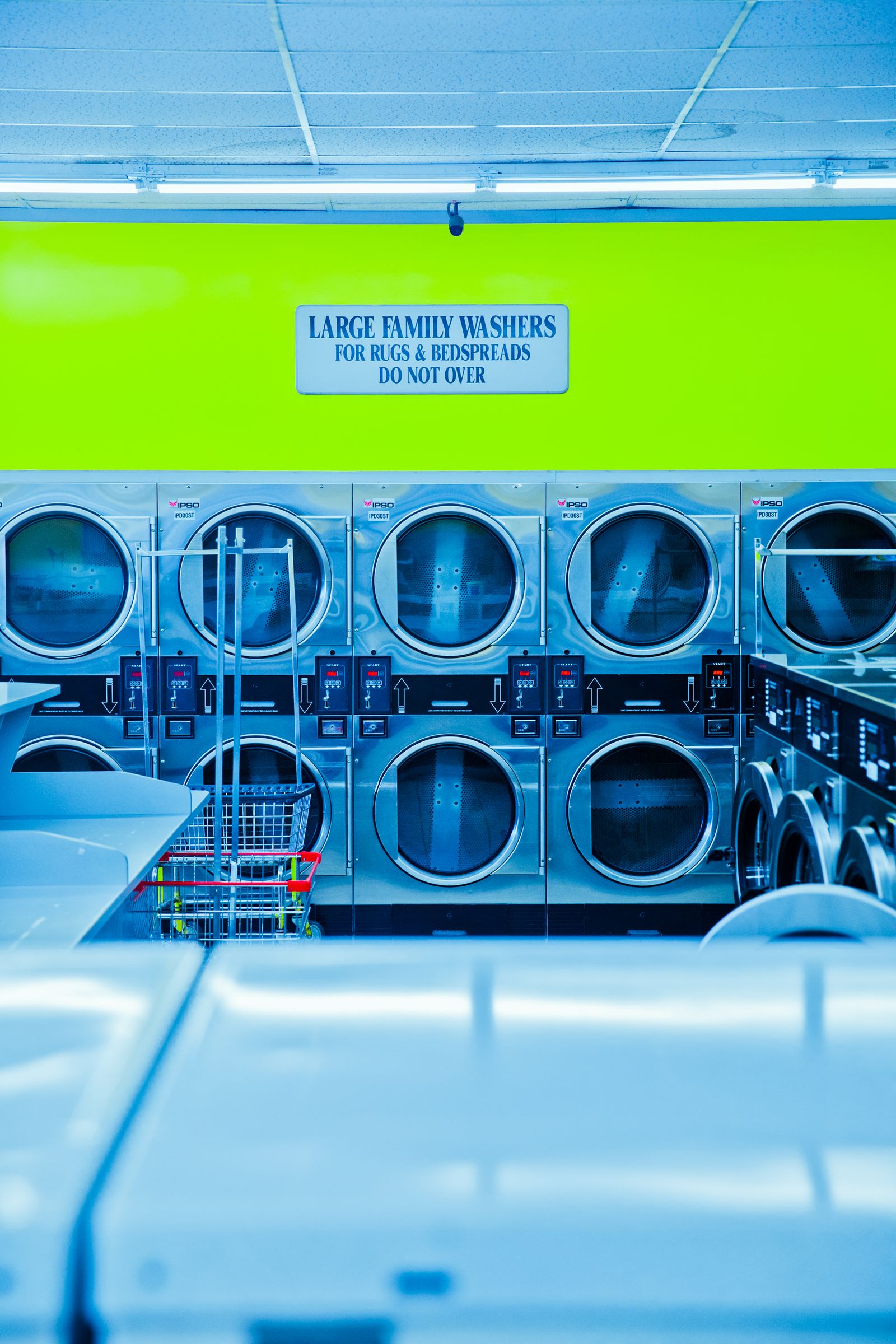 Stacked IPSO large family washers with lime-green header sign