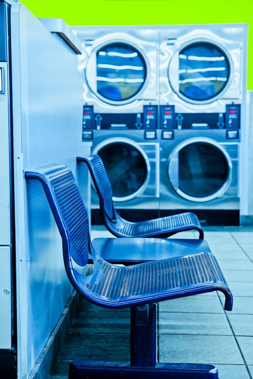 Free Photo of Blue Bench in Laundry Facility Stock Photo