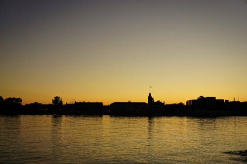 Free stock photo of clock tower, flag, lake