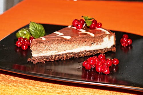 Free Rasp Berry Cake on Black Plate Stock Photo