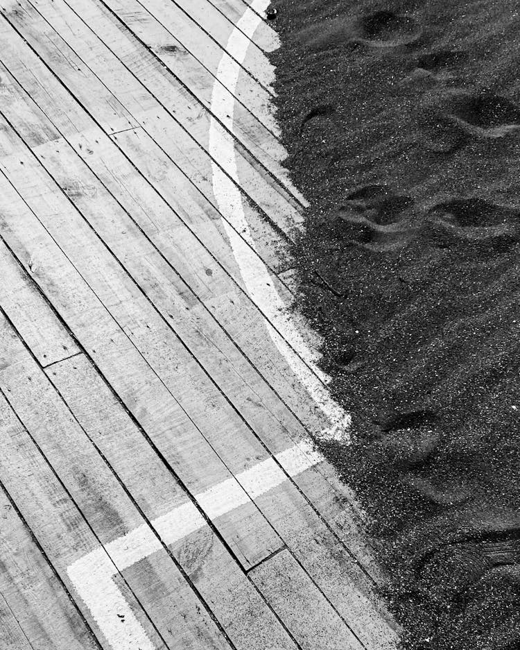 Black Sand On Wooden Flooring