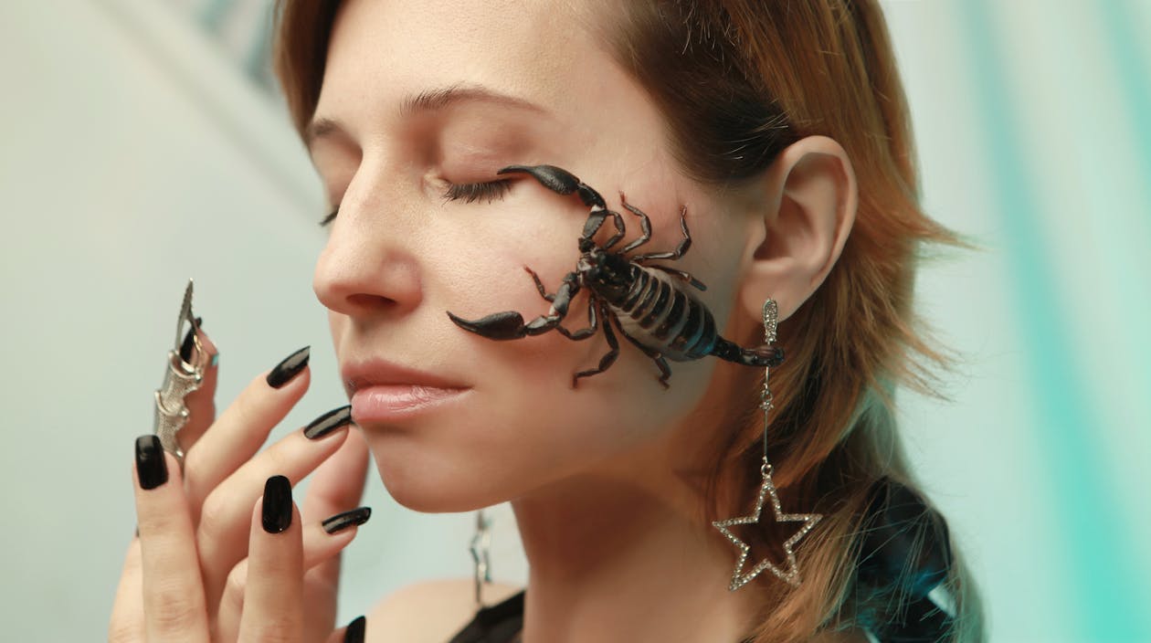 Photo of Scorpion on Woman's Face