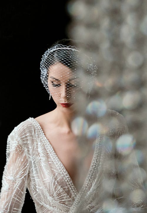 Free Charming bride in elegant white dress and veil Stock Photo