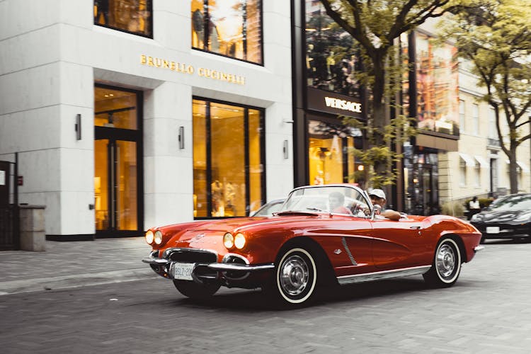 A Vintage Red Chevrolet Corvette Convertible In The Street