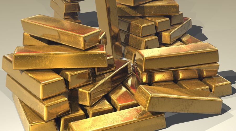 Pile of gold bars symbolising institutional accumulation of gold reserves and XAU trading