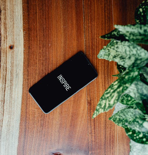Photo of Black Smartphone on Wooden Surface