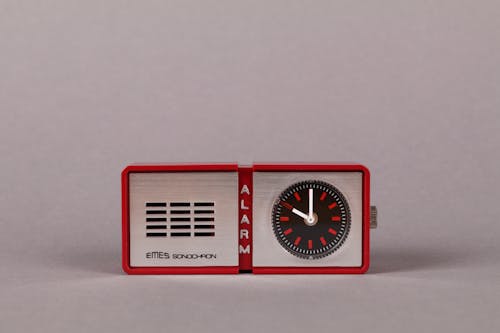 Close-Up Shot of a Red Alarm Clock