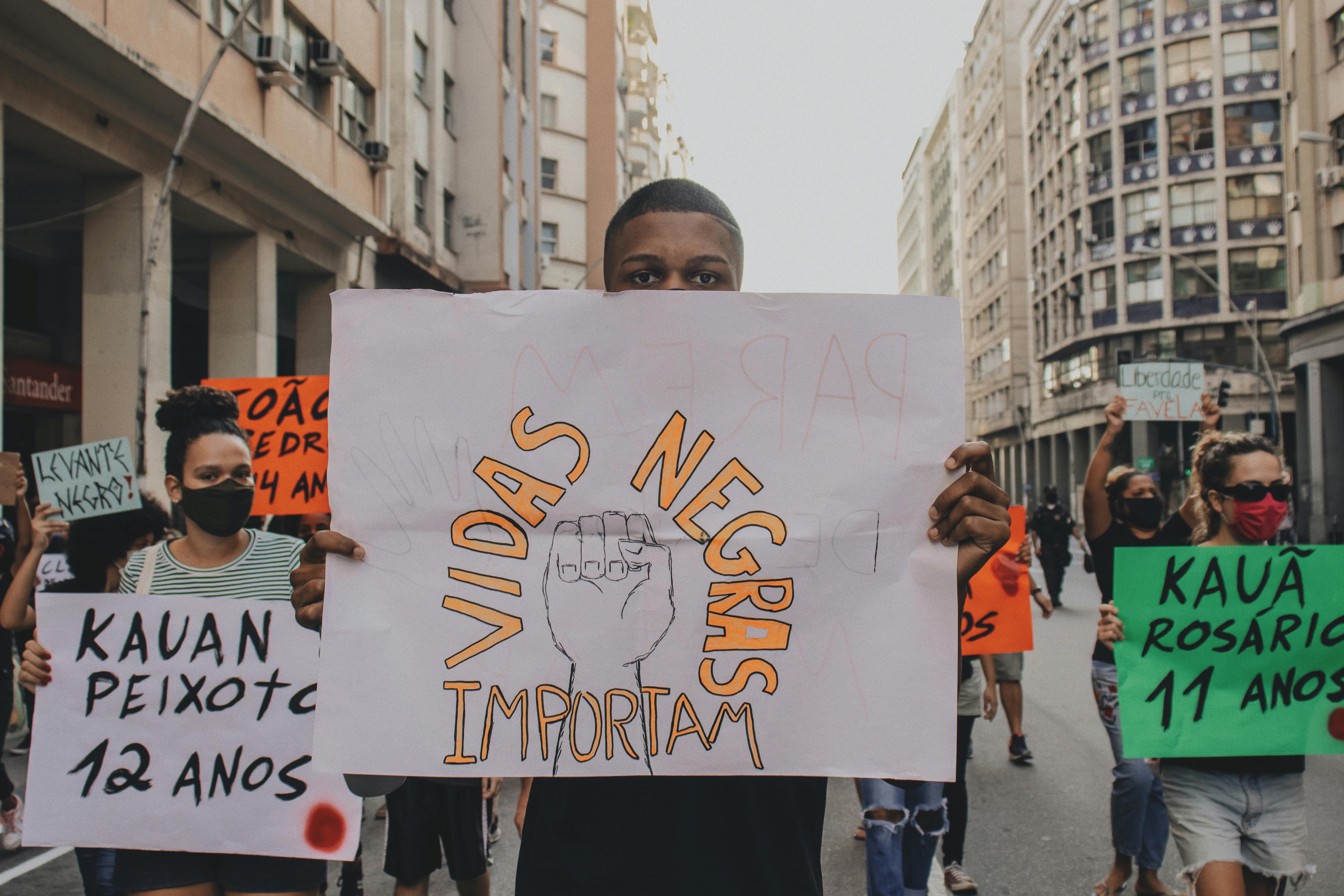 people holding protest banners